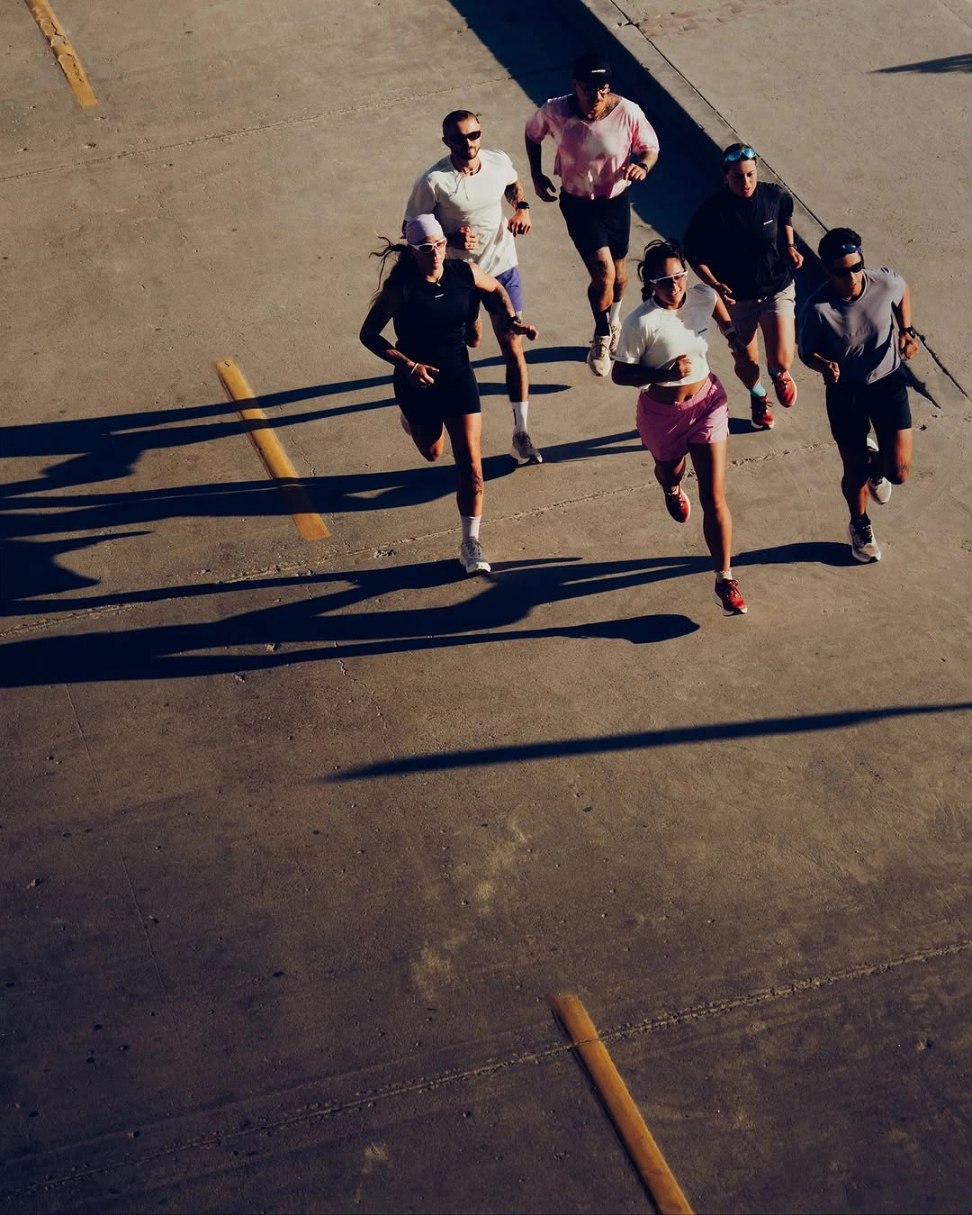 A group of runners moving together on concrete